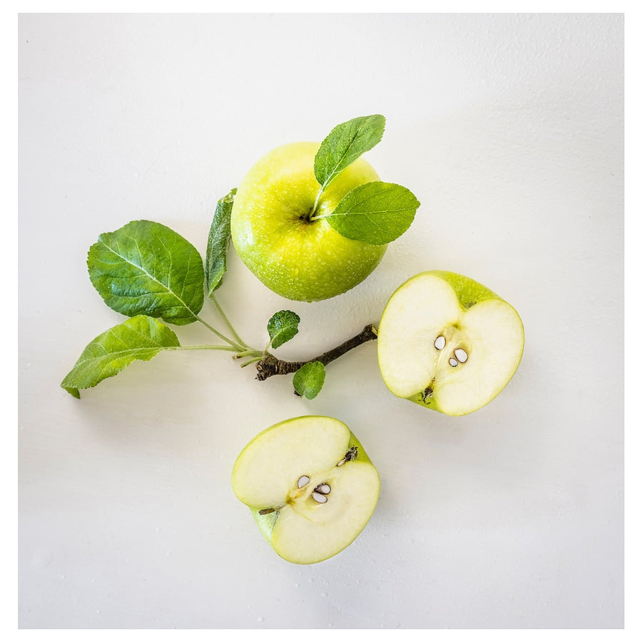 LÖVSKOGSLUND Scented candle in glass, apple/light green, 12 hr