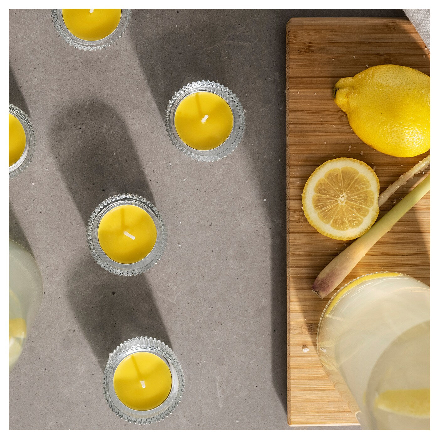 BLODHÄGG Scented tealight, lemon & lemongrass/yellow, 3.5 hr