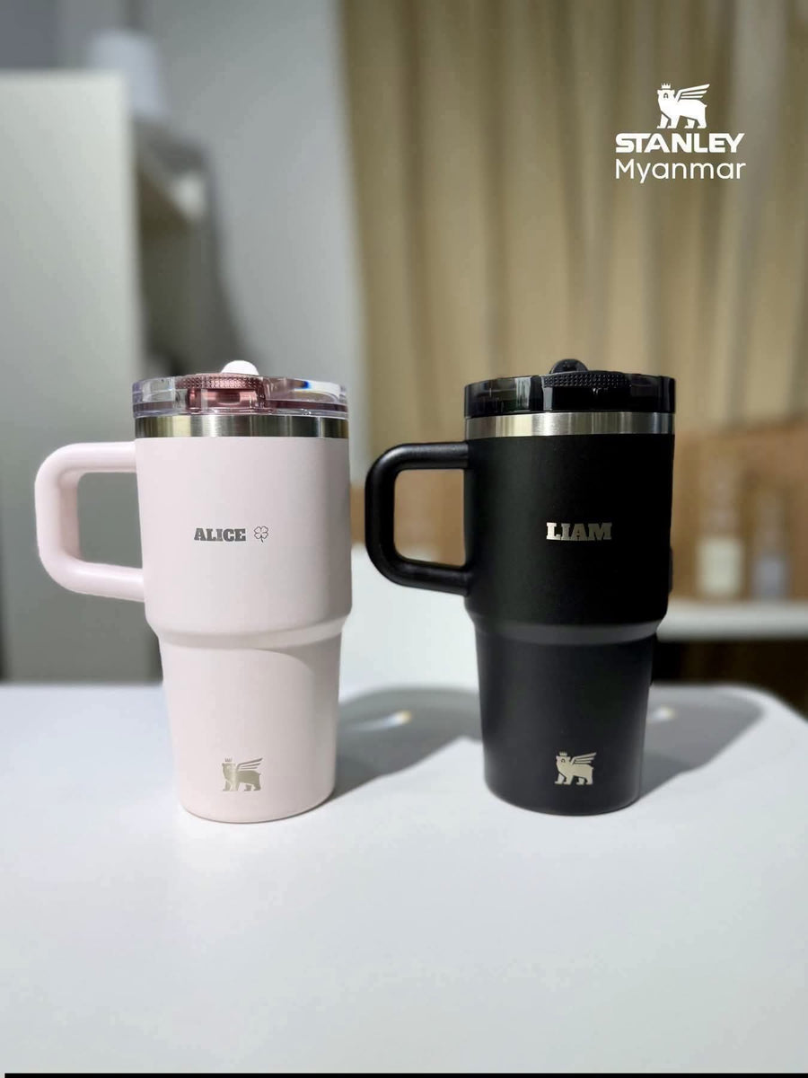 Two Stanley tumblers engraved with the names Alice and Liam